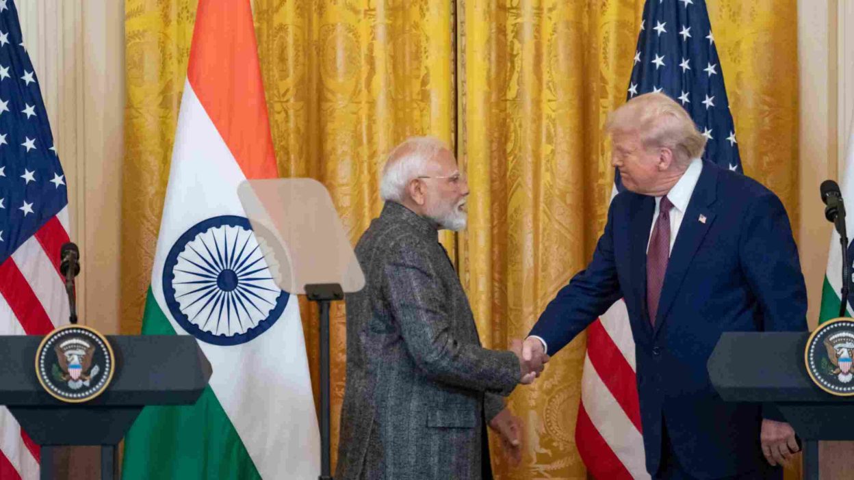 Modi and Trump shaking hands after agreement on lower tariffs between India and the U.S.