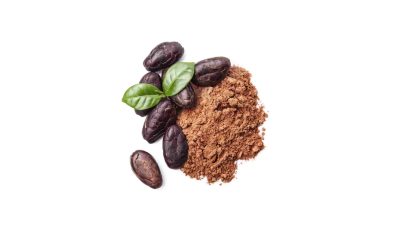 Raw cocoa beans representing boom-and-bust cycles in commodity markets